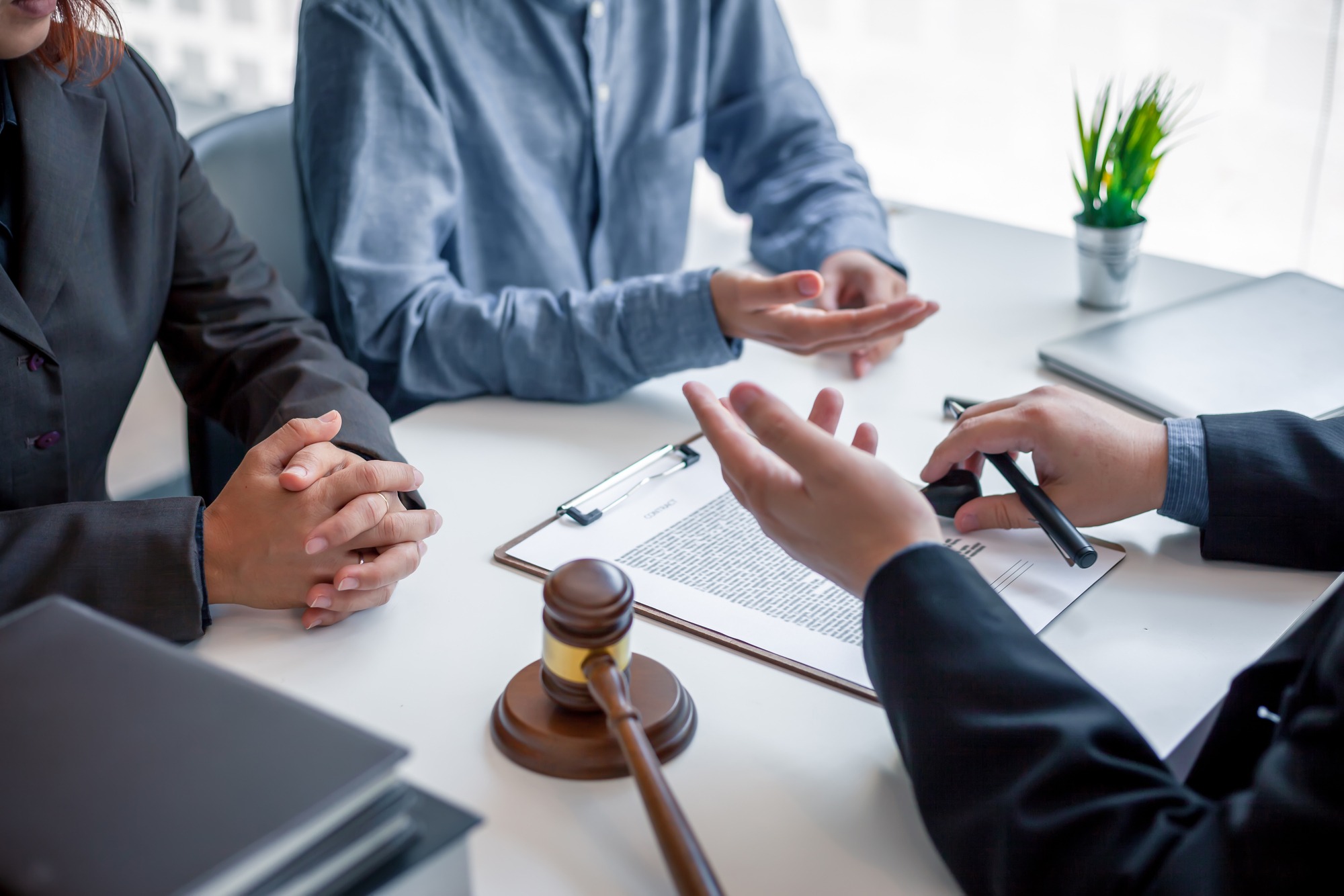 Businessman and lawyer discuss the contract document